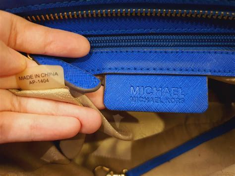 how can you tell a real michael kors purse|michael kors authentication serial number.